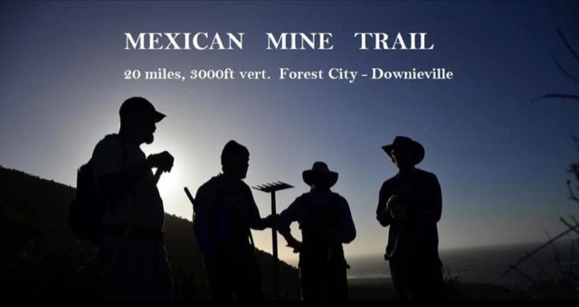 Silhouettes of four trail builders at dusk on the Mexican Mine Trail